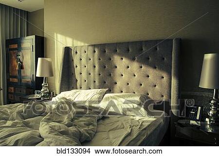 Window shining light onto unmade bed View Large Photo Image Picture - Window shining light onto unmade bed. Fotosearch
