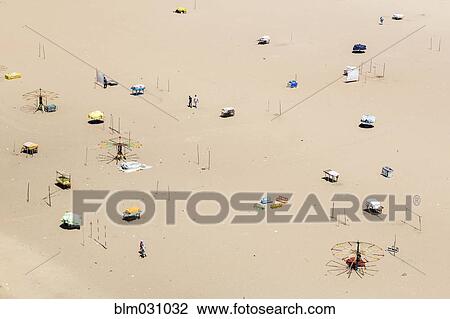 Stock Image - Aerial view of umbrellas on beach. Fotosearch