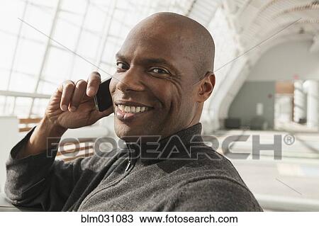 African American man talking on cell phone View Large Photo Image Stock Image - African American man talking on cell phone. Fotosearch