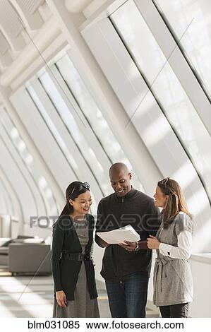 Business people talking in lobby View Large Photo Image Stock Photography - Business people talking in lobby. Fotosearch
