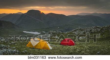 Camp tents in rocky rural landscape, Keswick, Cumbria, United Kingdom View Large Photo Image Stock Image - Camp tents in rocky rural landscape, Keswick, Cumbria, United Kingdom. Fotosearch
