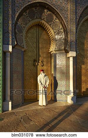 Caucasian man standing by ornate temple View Large Photo Image Stock Photo - Caucasian man standing by ornate temple. Fotosearch