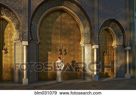 Stock Photo - Caucasian man standing by ornate temple. Fotosearch