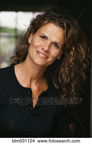 Caucasian woman smiling in doorway View Large Photo Image Picture - Caucasian woman smiling in doorway. Fotosearch