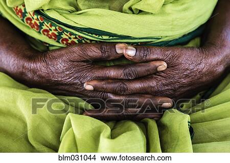 Close up of market seller's folded hands View Large Photo Image Picture - Close up of market seller's folded hands. Fotosearch