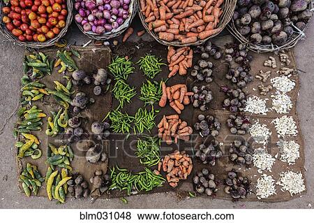 Stock Photo - Produce and spices for sale in market. Fotosearch