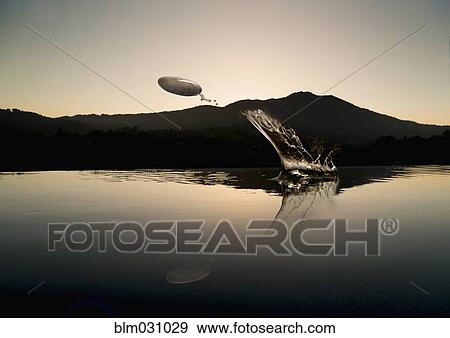 Stock Photo - Stone skipping on lake. Fotosearch