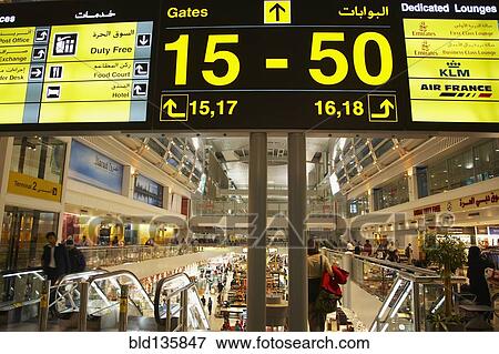 Airport sign in terminal, Dubai, United Arab Emirates View Large Photo Image Stock Photo - Airport sign in terminal, Dubai, United Arab Emirates. Fotosearch