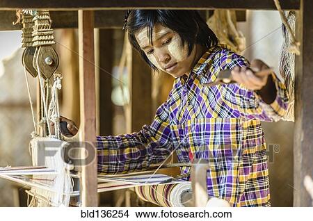 Picture - Asian girl weaving fabric. Fotosearch