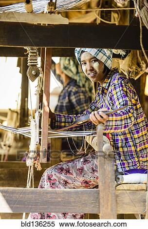 Stock Photography - Asian girl weaving fabric. Fotosearch