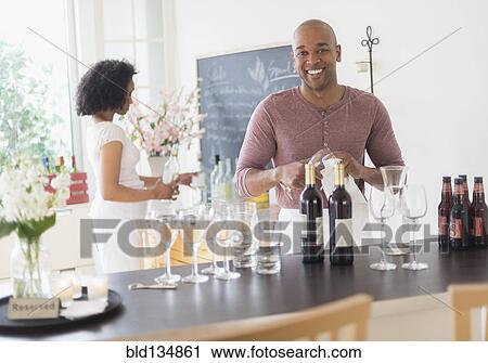 Black bartender smiling in restaurant View Large Photo Image Stock Image - Black bartender smiling in restaurant. Fotosearch