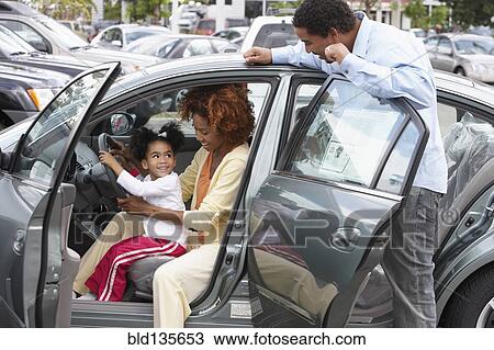 Black family admiring new car View Large Photo Image Stock Image - Black family admiring new car. Fotosearch