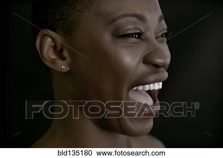 Stock Image - Black woman laughing. Fotosearch