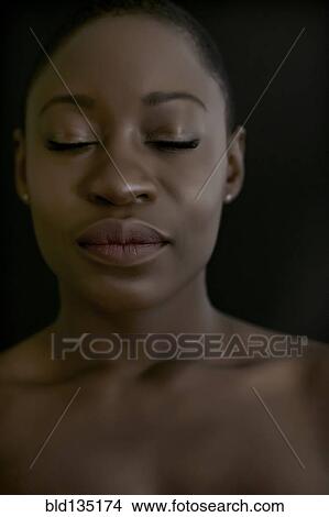 Black woman with eyes closed View Large Photo Image Picture - Black woman with eyes closed. Fotosearch