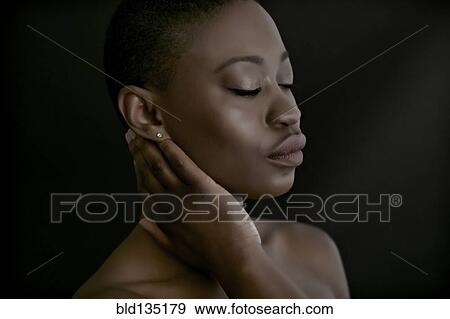 Black woman with hand on neck View Large Photo Image Stock Photo - Black woman with hand on neck. Fotosearch