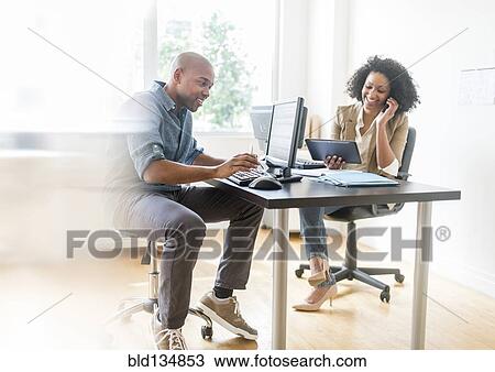 Business people working in office View Large Photo Image Stock Image - Business people working in office. Fotosearch