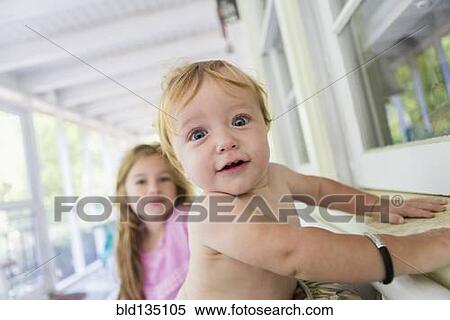 Caucasian baby and sister sitting on porch View Large Photo Image Stock Photography - Caucasian baby and sister sitting on porch. Fotosearch