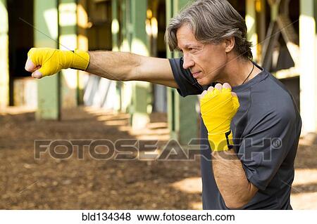 Caucasian boxer with fists raised View Large Photo Image Stock Photo - Caucasian boxer with fists raised. Fotosearch