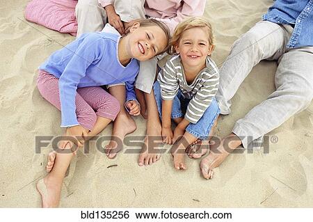 Caucasian children smiling on beach View Large Photo Image Stock Photograph - Caucasian children smiling on beach. Fotosearch