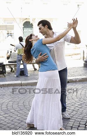 Caucasian couple dancing on city street View Large Photo Image Stock Image - Caucasian couple dancing on city street. Fotosearch