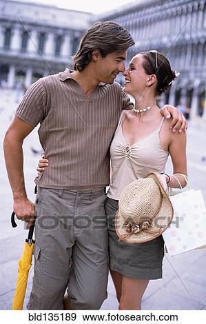 Caucasian couple hugging in St. Mark's Square, Venice, Veneto, Italy View Large Photo Image Stock Photo - Caucasian couple hugging in St. Mark's Square, Venice, Veneto, Italy. Fotosearch