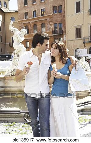Stock Photo - Caucasian couple with map at Piazza Novona, Rome, Italy. Fotosearch