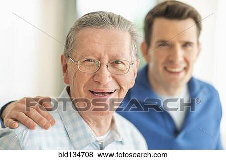 Caucasian father and son smiling View Large Photo Image Stock Photo - Caucasian father and son smiling. Fotosearch