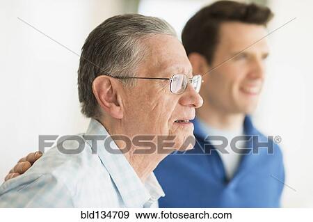 Caucasian father and son smiling View Large Photo Image Stock Photo - Caucasian father and son smiling. Fotosearch