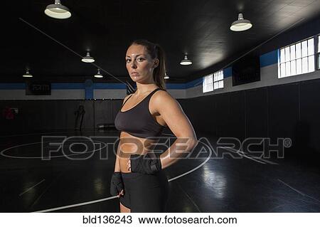 Stock Image - Caucasian fighter standing in gym. Fotosearch