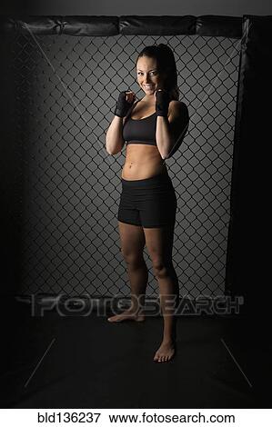 Caucasian fighter standing in gym View Large Photo Image Stock Photo - Caucasian fighter standing in gym. Fotosearch