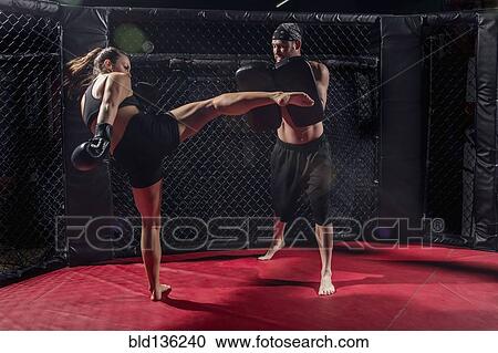 Stock Image - Caucasian fighters training in gym. Fotosearch