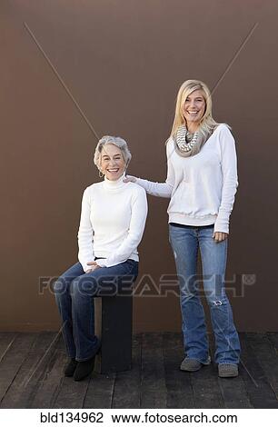 Caucasian mother and daughter smiling together View Large Photo Image Stock Image - Caucasian mother and daughter smiling together. Fotosearch