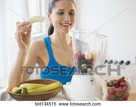 Caucasian woman blending fruit smoothie View Large Photo Image Stock Photography - Caucasian woman blending fruit smoothie. Fotosearch