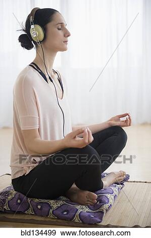 Stock Photo - Caucasian woman meditating. Fotosearch