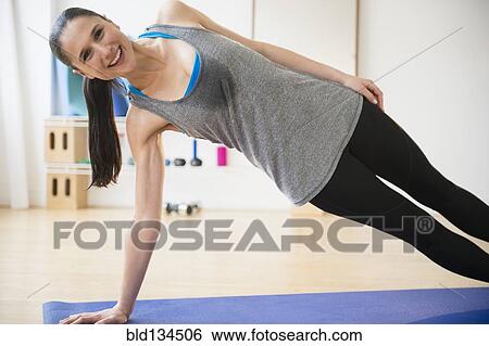 Caucasian woman practicing yoga View Large Photo Image Stock Photograph - Caucasian woman practicing yoga. Fotosearch