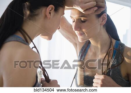 Caucasian woman resting after exercise View Large Photo Image Picture - Caucasian woman resting after exercise. Fotosearch