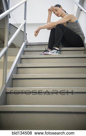 Caucasian woman resting after exercise View Large Photo Image Stock Photo - Caucasian woman resting after exercise. Fotosearch
