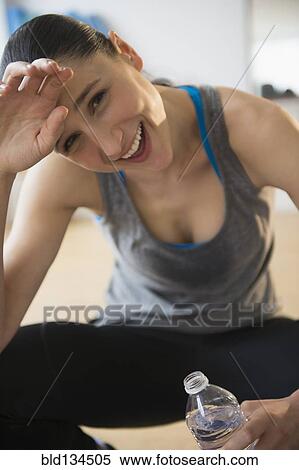 Caucasian woman resting after exercise View Large Photo Image Stock Photography - Caucasian woman resting after exercise. Fotosearch