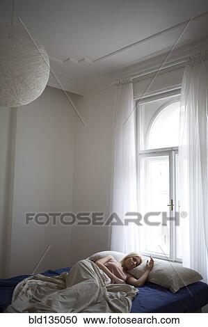 Caucasian woman sleeping in bed View Large Photo Image Stock Image - Caucasian woman sleeping in bed. Fotosearch