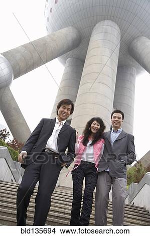Chinese business people under Oriental Pearl Tower, Shanghai, China View Large Photo Image Picture - Chinese business people under Oriental Pearl Tower, Shanghai, China. Fotosearch
