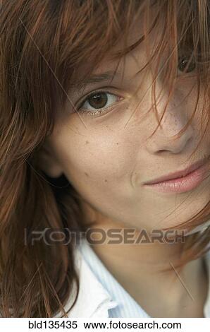 Stock Photography - Close up of girl's smiling face. Fotosearch