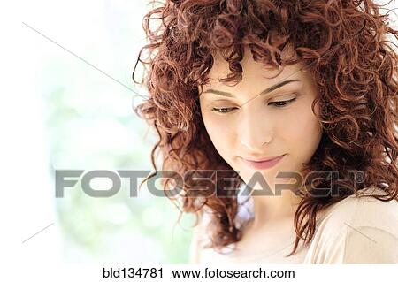 Stock Image - Close up of Hispanic woman's face. Fotosearch