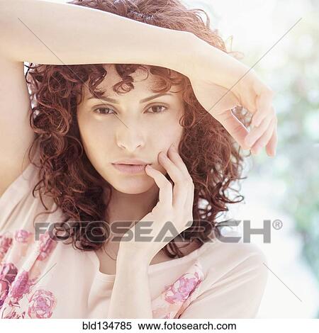 Stock Photography - Close up of Hispanic woman's face. Fotosearch