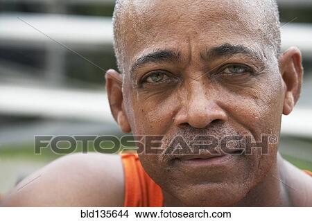 Picture - Close up of man's serious face. Fotosearch
