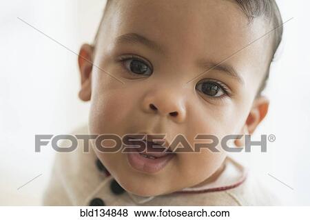 Stock Photo - Close up of mixed race baby's face. Fotosearch