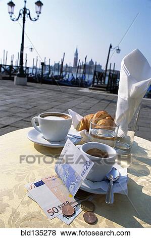 Coffee, pastries and money at sidewalk cafe View Large Photo Image Stock Photo - Coffee, pastries and money at sidewalk cafe. Fotosearch