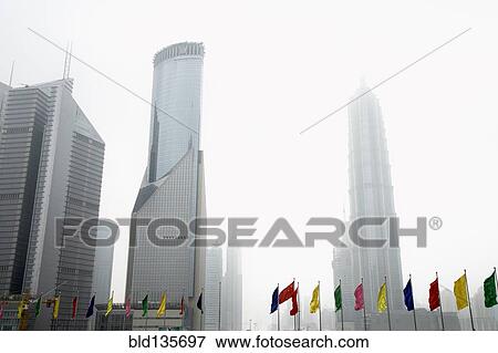 Colorful flags and urban skyscrapers, Shanghai, China View Large Photo Image Stock Photo - Colorful flags and urban skyscrapers, Shanghai, China. Fotosearch