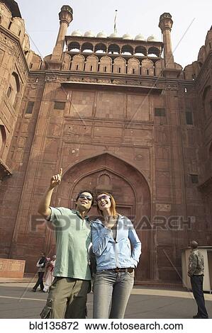Couple admiring Red Fort, Delhi, India View Large Photo Image Stock Image - Couple admiring Red Fort, Delhi, India. Fotosearch