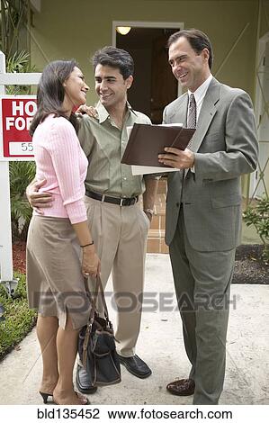 Couple and realtor signing papers for new house View Large Photo Image Stock Image - Couple and realtor signing papers for new house. Fotosearch