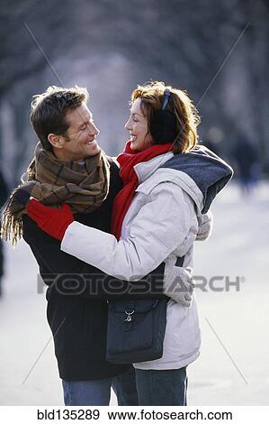 Couple hugging in urban park View Large Photo Image Stock Photo - Couple hugging in urban park. Fotosearch